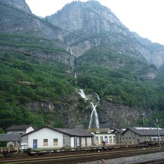 Crossing waterfall at Biasca train station
