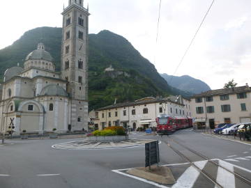 Swiss train riding through Italian town